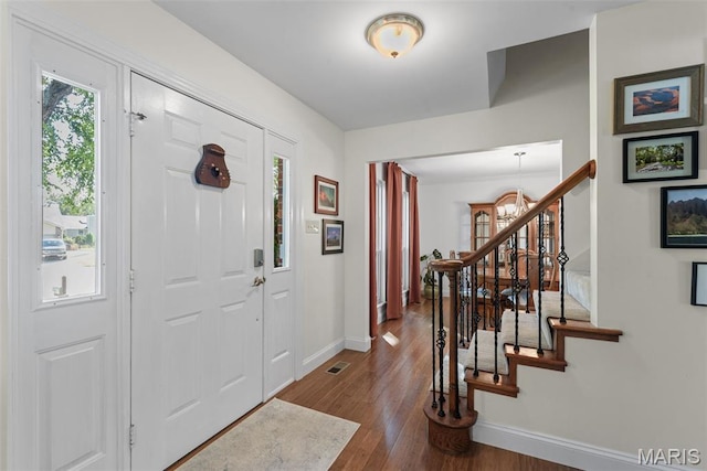 113 Christine Cay Ct, Saint Charles, MO 63304 - entryway featuring baseboards, dark wood-type flooring, and stairs