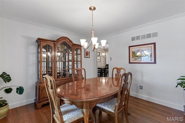 113 Christine Cay Ct, Saint Charles, MO 63304 - dining area with wood finished floors, a chandelier, baseboards, and crown molding
