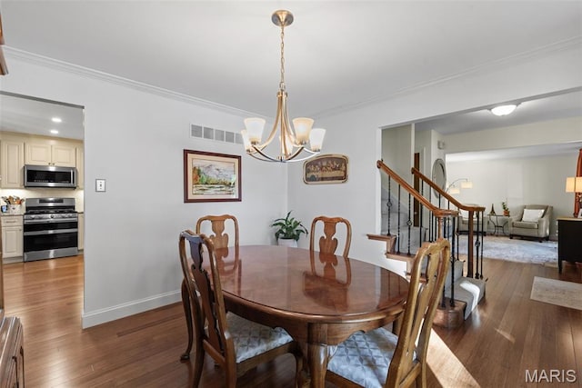 113 Christine Cay Ct, Saint Charles, MO 63304 - dining room featuring ornamental molding, hardwood / wood-style floors, a chandelier, baseboards, and stairs
