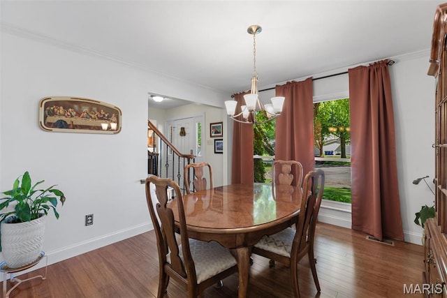 113 Christine Cay Ct, Saint Charles, MO 63304 - dining space featuring a chandelier, wood finished floors, stairway, baseboards, and ornamental molding