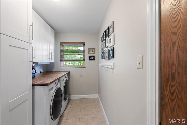 113 Christine Cay Ct, Saint Charles, MO 63304 - laundry room with cabinet space, independent washer and dryer, baseboards, and light tile patterned floors