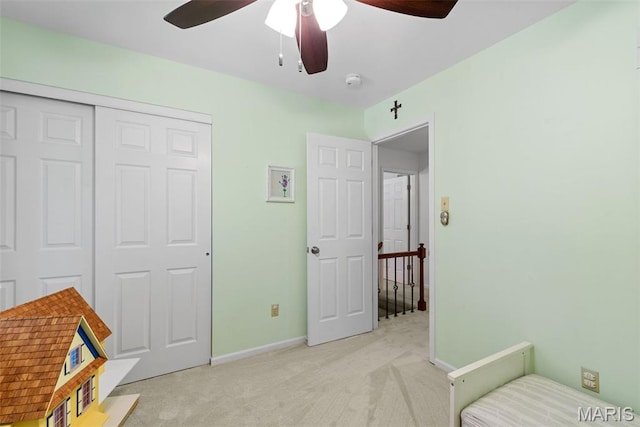113 Christine Cay Ct, Saint Charles, MO 63304 - bedroom featuring light colored carpet, a closet, baseboards, and a ceiling fan