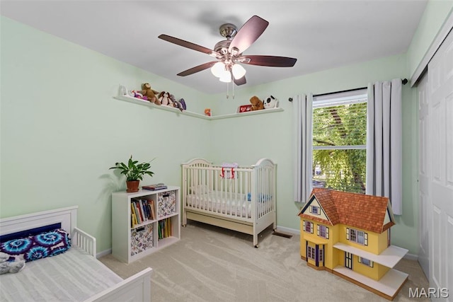 113 Christine Cay Ct, Saint Charles, MO 63304 - bedroom featuring a closet, carpet, baseboards, a nursery area, and a ceiling fan