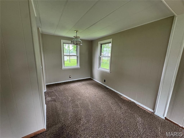 516 S 12th St, Bowling Green, MO 63334 - carpeted empty room with a chandelier and baseboards