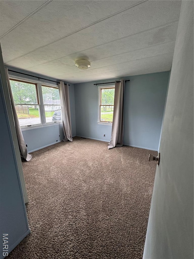 516 S 12th St, Bowling Green, MO 63334 - unfurnished room with carpet, a textured ceiling, and baseboards
