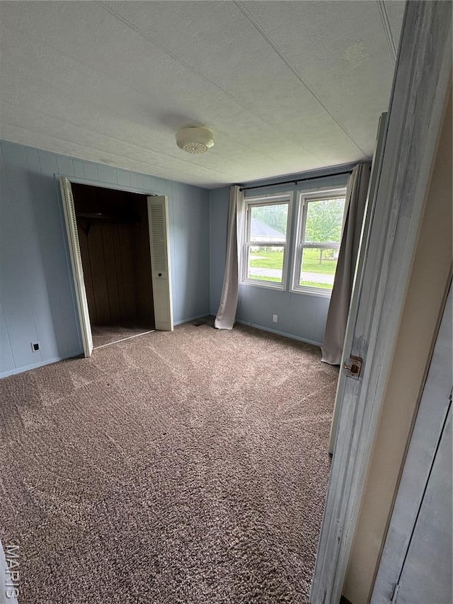 516 S 12th St, Bowling Green, MO 63334 - unfurnished bedroom with a textured ceiling and carpet