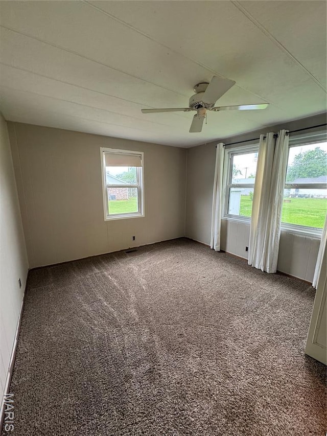 516 S 12th St, Bowling Green, MO 63334 - unfurnished room featuring healthy amount of natural light, carpet, and a ceiling fan