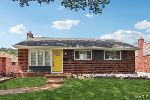 1525 79th St, Saint Louis, MO 63130 - view of front of house featuring brick siding, a front yard, and a chimney