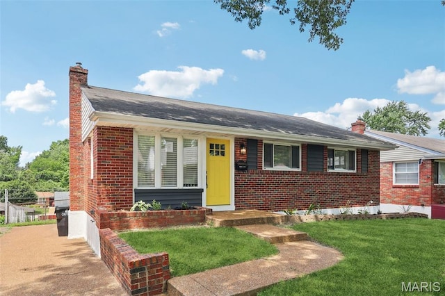 1525 79th St, Saint Louis, MO 63130 - view of front of house with brick siding, a chimney, and a front yard