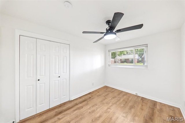 1525 79th St, Saint Louis, MO 63130 - unfurnished bedroom with a closet, light wood-style flooring, and a ceiling fan