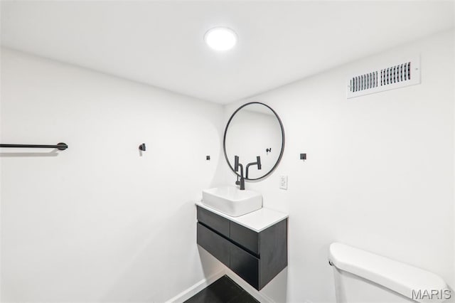 1525 79th St, Saint Louis, MO 63130 - half bathroom featuring toilet and vanity