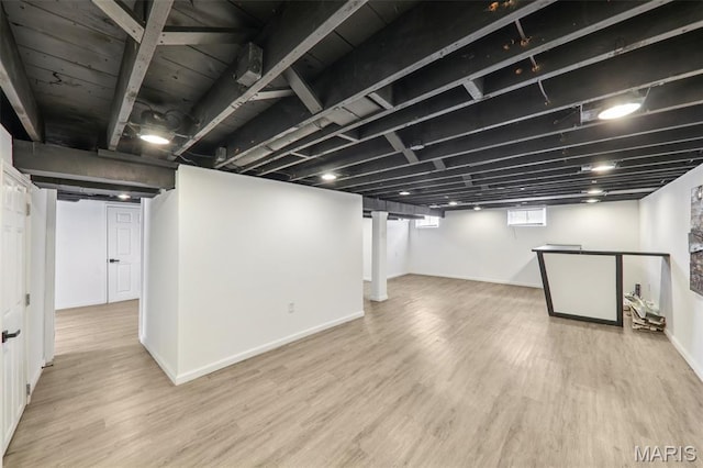 1525 79th St, Saint Louis, MO 63130 - below grade area with wood finished floors and baseboards