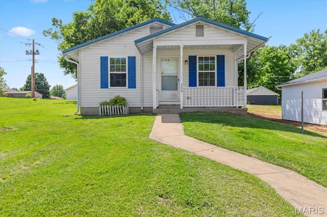 206 6th St, Park Hills, MO 63601 - view of front of home featuring a porch and a front yard