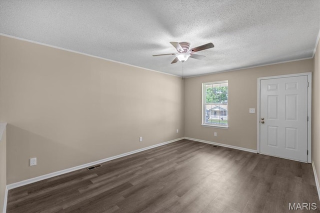 206 6th St, Park Hills, MO 63601 - spare room with dark wood finished floors, ceiling fan, a textured ceiling, baseboards, and ornamental molding