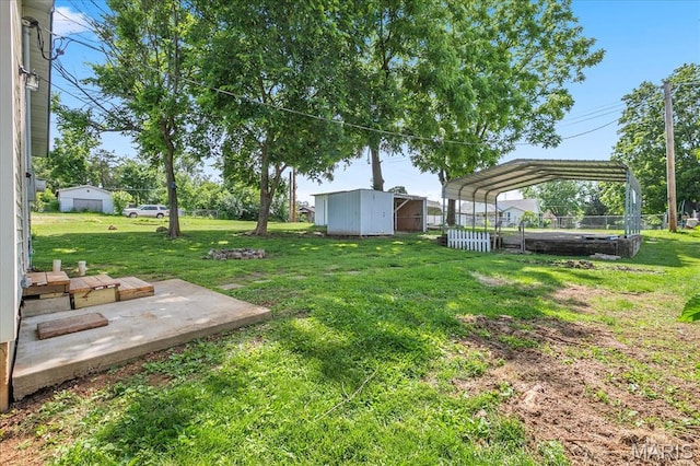 206 6th St, Park Hills, MO 63601 - view of green lawn featuring a carport and an outbuilding