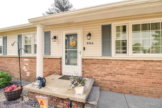 906 E Fairgrounds Ave, Jerseyville, IL 62052 - doorway to property featuring brick siding and covered porch