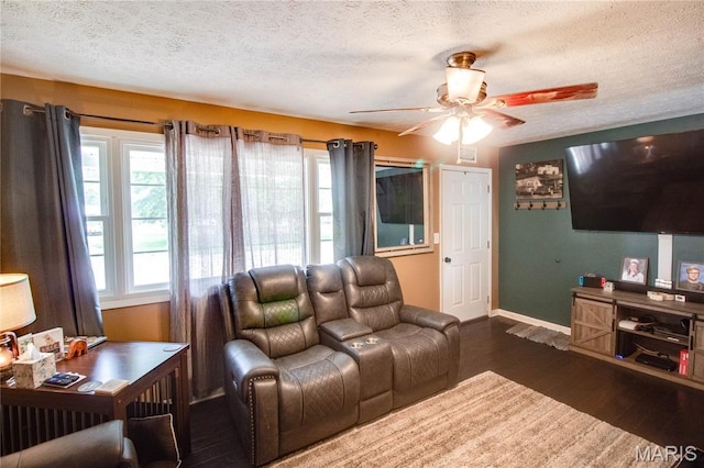 906 E Fairgrounds Ave, Jerseyville, IL 62052 - living area featuring ceiling fan, wood finished floors, plenty of natural light, a textured ceiling, and baseboards