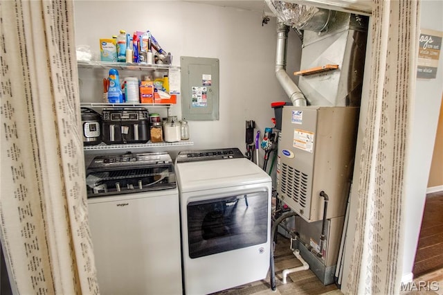 906 E Fairgrounds Ave, Jerseyville, IL 62052 - laundry room featuring washing machine and clothes dryer, electric panel, and wood finished floors