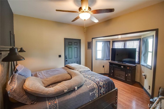 906 E Fairgrounds Ave, Jerseyville, IL 62052 - bedroom featuring light wood-style floors and ceiling fan