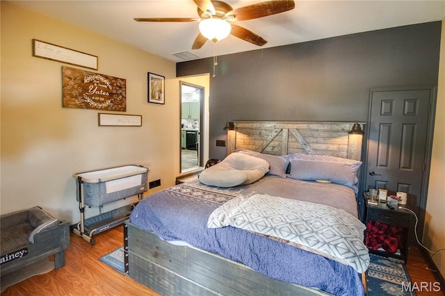 906 E Fairgrounds Ave, Jerseyville, IL 62052 - bedroom with wood finished floors and a ceiling fan