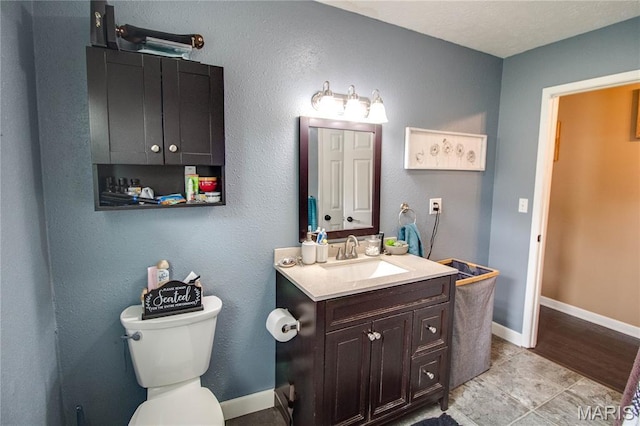 906 E Fairgrounds Ave, Jerseyville, IL 62052 - half bath featuring vanity, toilet, and baseboards