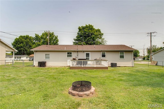 906 E Fairgrounds Ave, Jerseyville, IL 62052 - rear view of house with central AC, an outdoor fire pit, and a deck