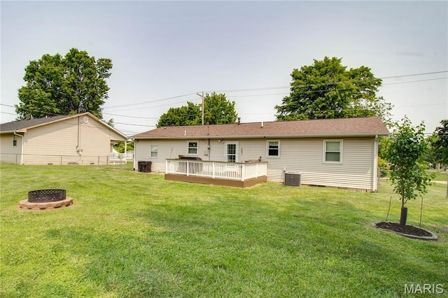 906 E Fairgrounds Ave, Jerseyville, IL 62052 - rear view of property with a fire pit, a wooden deck, and central AC