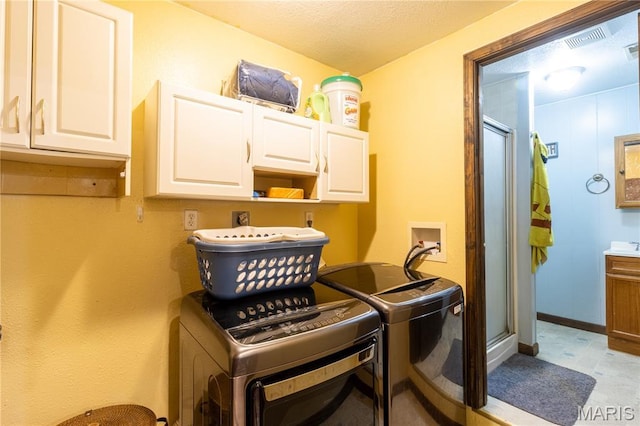 465 County Road 5120, Salem, MO 65560 - laundry room with cabinet space, washing machine and clothes dryer, and a textured ceiling