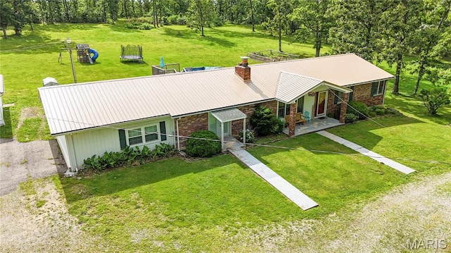465 County Road 5120, Salem, MO 65560 - view of front of house featuring brick siding, a front yard, a metal roof, and a chimney