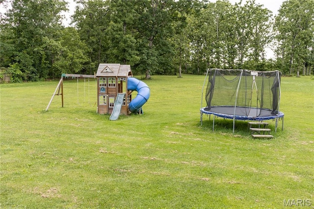 465 County Road 5120, Salem, MO 65560 - view of grassy yard featuring a trampoline, a playground, and view of scattered trees