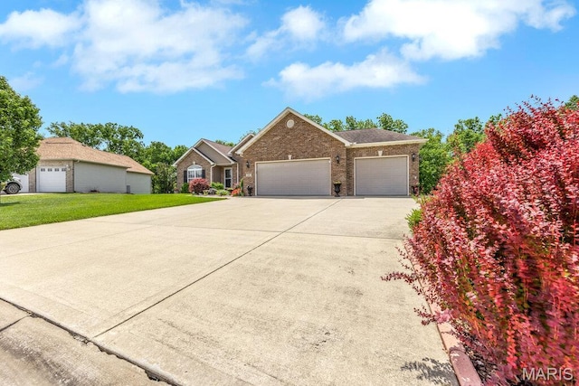 1020 Oak Creek Ln, Waterloo, IL 62298 - view of front of property with brick siding, an attached garage, concrete driveway, and a front yard