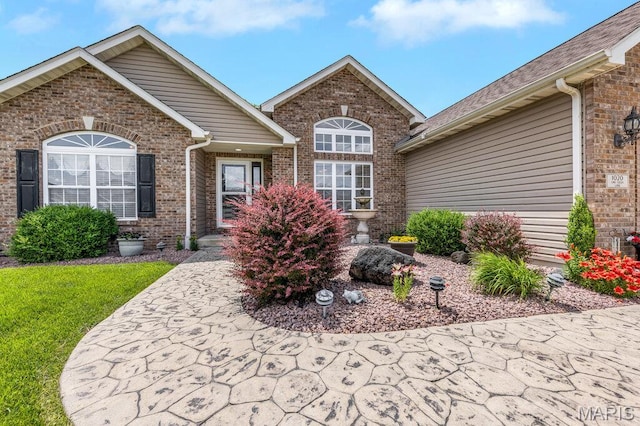 1020 Oak Creek Ln, Waterloo, IL 62298 - doorway to property with brick siding and a yard
