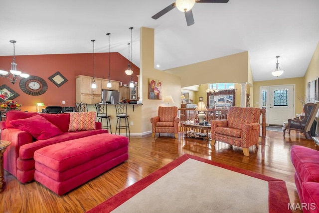 1020 Oak Creek Ln, Waterloo, IL 62298 - living area featuring a chandelier, wood finished floors, ceiling fan, and high vaulted ceiling