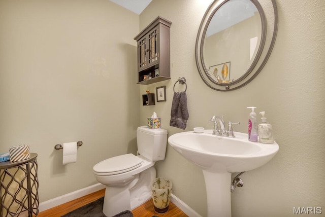 1020 Oak Creek Ln, Waterloo, IL 62298 - bathroom featuring wood finished floors, toilet, and baseboards