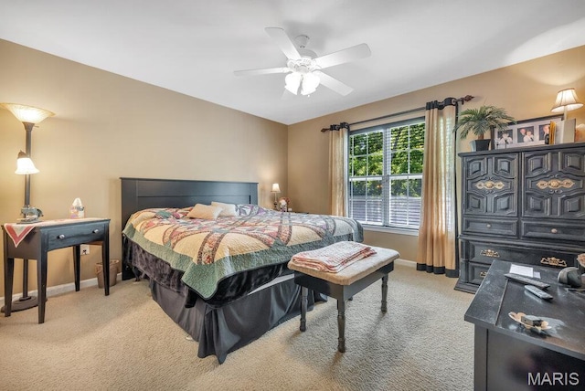 1020 Oak Creek Ln, Waterloo, IL 62298 - bedroom with baseboards, light carpet, and ceiling fan