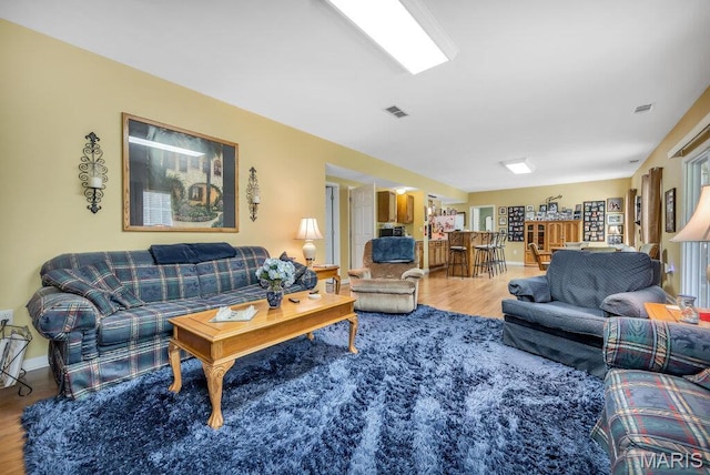 1020 Oak Creek Ln, Waterloo, IL 62298 - living room featuring wood finished floors and baseboards