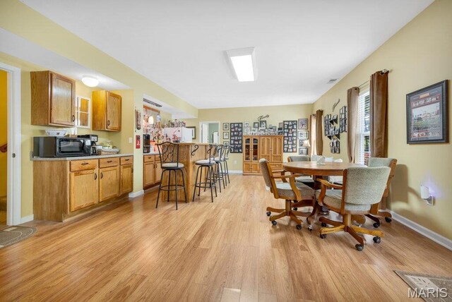 1020 Oak Creek Ln, Waterloo, IL 62298 - dining room with light wood-style flooring and baseboards