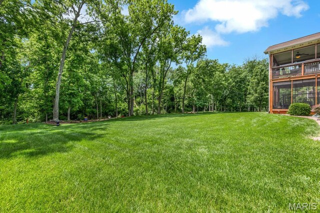 1020 Oak Creek Ln, Waterloo, IL 62298 - view of green lawn featuring a sunroom and ceiling fan
