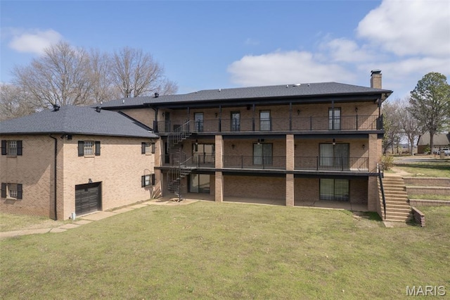305 Ridge Dr, Sikeston, MO 63801 - back of house featuring stairway, a chimney, and a yard