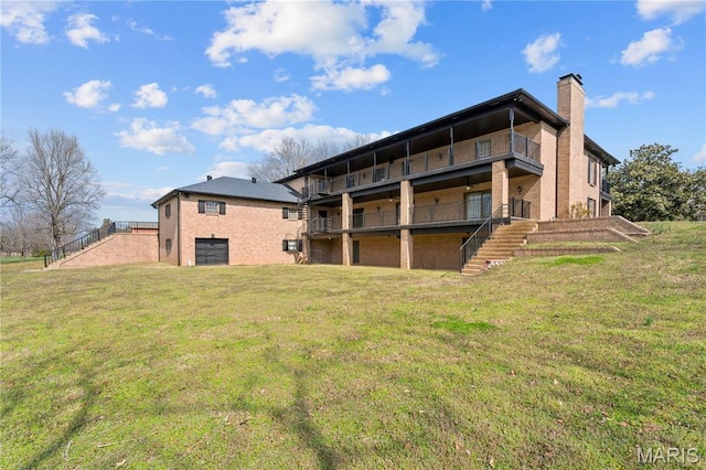 305 Ridge Dr, Sikeston, MO 63801 - back of house with stairs, a chimney, a lawn, and brick siding
