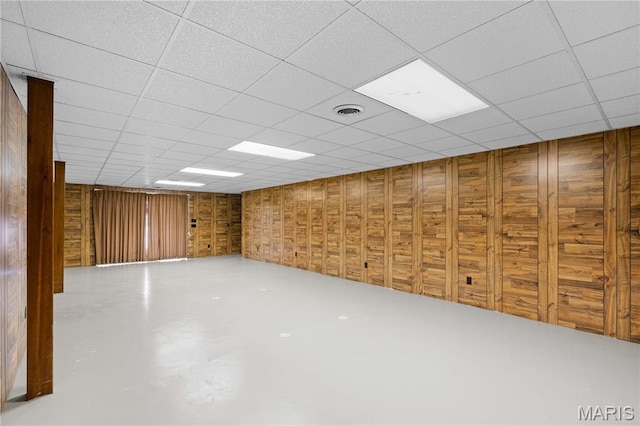 305 Ridge Dr, Sikeston, MO 63801 - basement with wood walls and a paneled ceiling