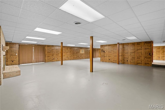 305 Ridge Dr, Sikeston, MO 63801 - below grade area with wooden walls and a drop ceiling