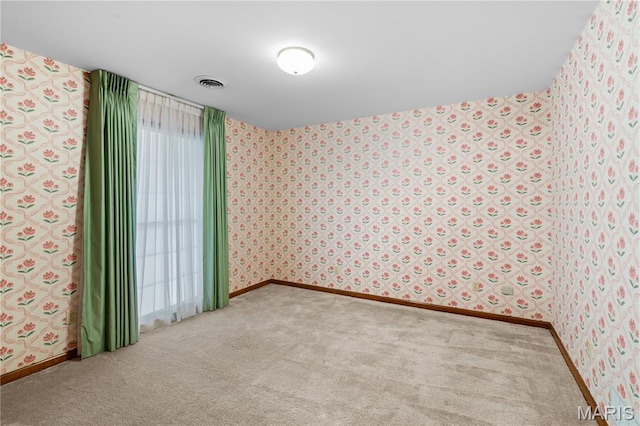 305 Ridge Dr, Sikeston, MO 63801 - unfurnished room with wallpapered walls, carpet, and baseboards