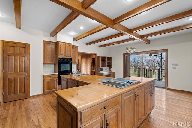 305 Ridge Dr, Sikeston, MO 63801 - kitchen with stovetop with downdraft, baseboards, beam ceiling, recessed lighting, and light wood-type flooring