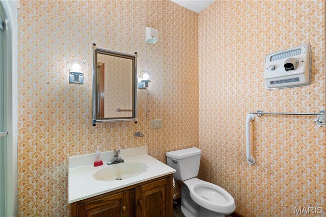 305 Ridge Dr, Sikeston, MO 63801 - half bathroom with vanity and toilet