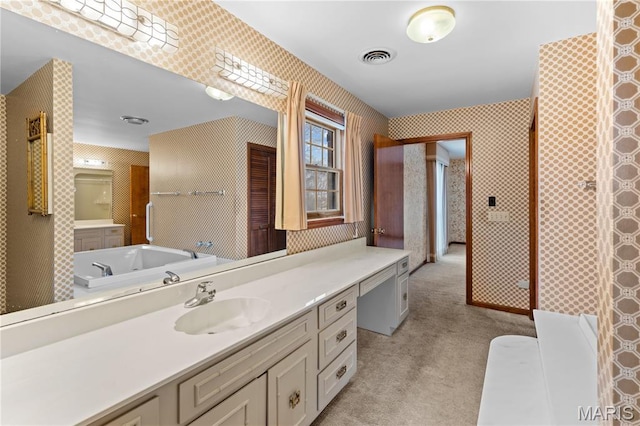 305 Ridge Dr, Sikeston, MO 63801 - bathroom featuring vanity, wallpapered walls, and a garden tub