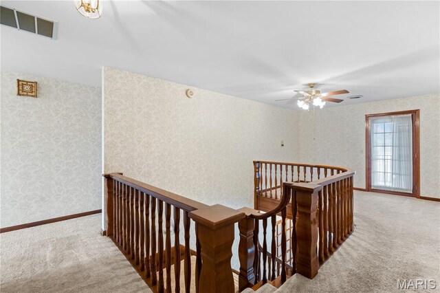 305 Ridge Dr, Sikeston, MO 63801 - corridor featuring an upstairs landing, carpet floors, wallpapered walls, and baseboards