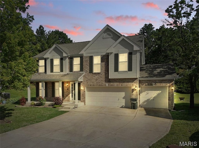 5886 Birchmont Place Dr, Oakville, MO 63129 - view of front facade featuring concrete driveway, a front yard, brick siding, a garage, and a shingled roof