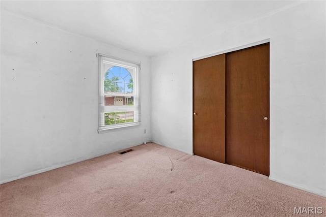 1466 Friar Tuck Ln, Lemay Township, MO 63125 - unfurnished bedroom featuring carpet and a closet