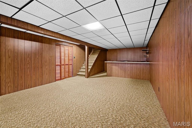 1466 Friar Tuck Ln, Lemay Township, MO 63125 - indoor dry bar with wood walls, stairway, and carpet flooring